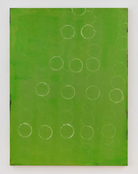 A green painting featuring circle oulines, made by Sharon Butler